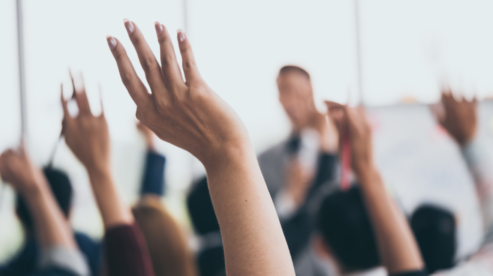 Digital PI Planning demonstrated by image of raised hands
