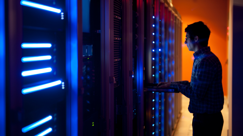 Man in server room demonstrating reduced security risks