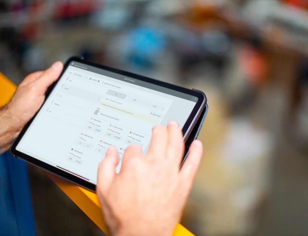 Photo of a customer using iObeya solution for Lean Manufacturing practices on a tablet