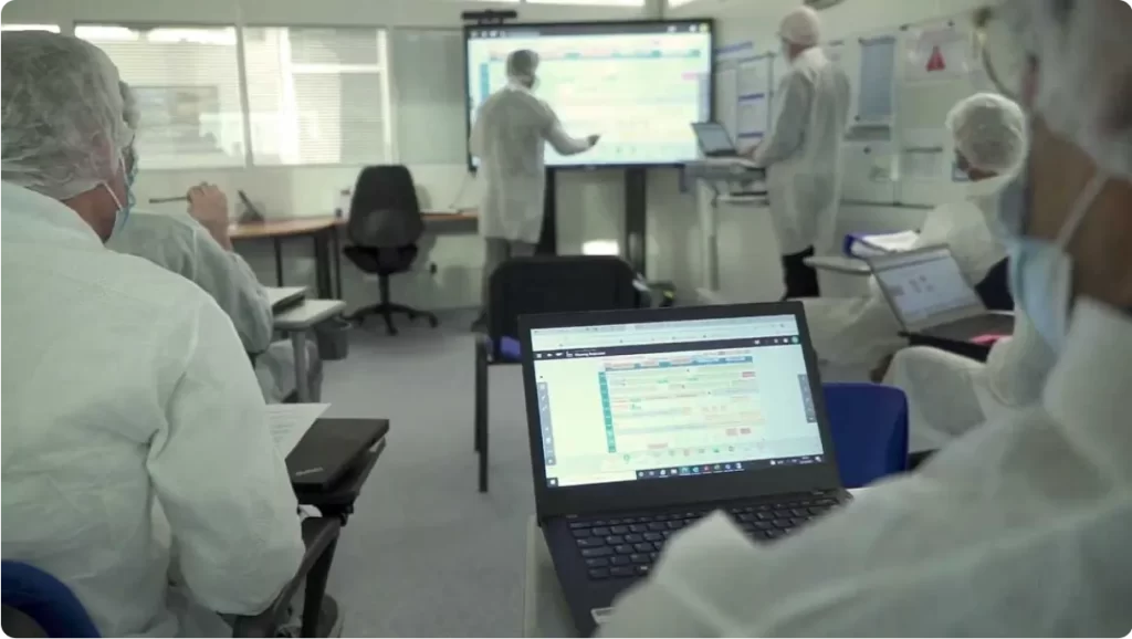 Photo of a lab where employees are working on iObeya lean software