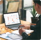 An employee works on an iObeya board in a digital Obeya